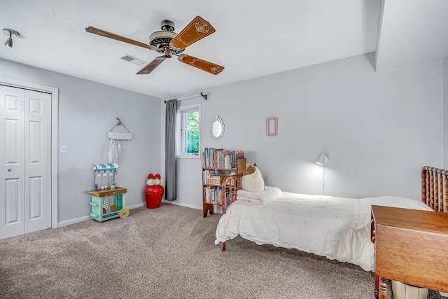 9180 Dicey St, Montague, MI 49437 - carpeted bedroom with baseboards, a ceiling fan, and a closet