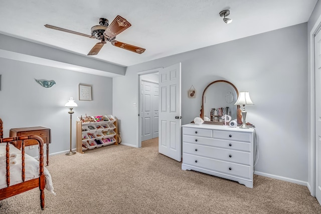 9180 Dicey St, Montague, MI 49437 - bedroom with light colored carpet, baseboards, and a ceiling fan