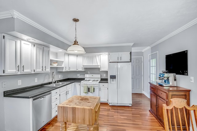 9180 Dicey St, Montague, MI 49437 - kitchen with white appliances, a sink, dark countertops, open shelves, and crown molding