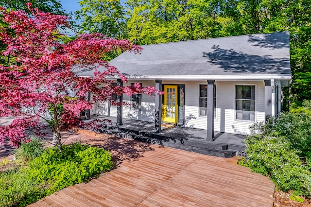 9180 Dicey St, Montague, MI 49437 - view of front facade with a porch and a shingled roof