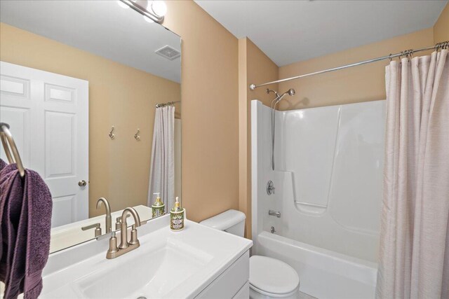 1269 Apple Creek Dr SE, Grand Rapids, MI 49546 - full bathroom with toilet, vanity, and shower / bath combo with shower curtain