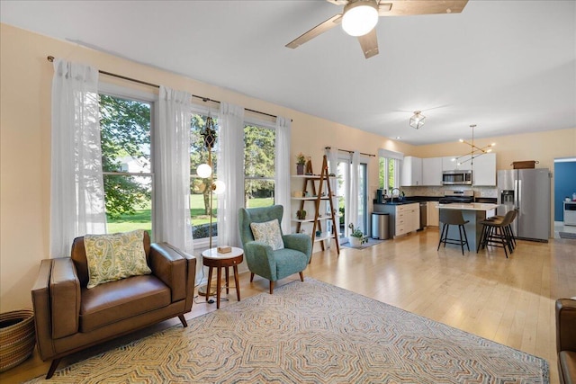 1269 Apple Creek Dr SE, Grand Rapids, MI 49546 - living area with ceiling fan and light wood-style flooring