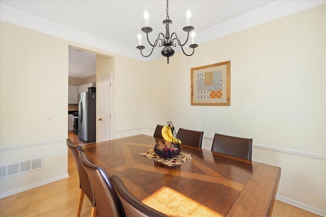 1269 Apple Creek Dr SE, Grand Rapids, MI 49546 - dining space featuring a chandelier, light wood-style flooring, ornamental molding, and baseboards