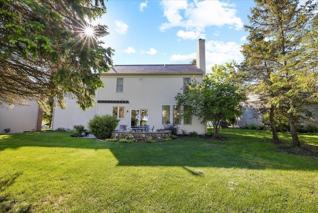 1269 Apple Creek Dr SE, Grand Rapids, MI 49546 - rear view of house with a yard and a chimney