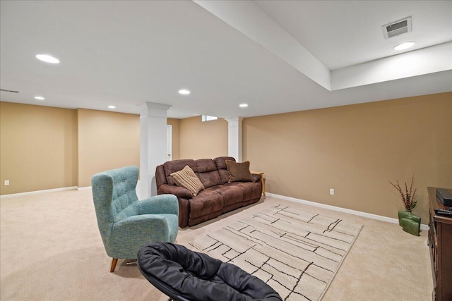1269 Apple Creek Dr SE, Grand Rapids, MI 49546 - living area with light carpet, ornate columns, recessed lighting, and baseboards