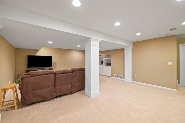 1269 Apple Creek Dr SE, Grand Rapids, MI 49546 - living room featuring light colored carpet, ornate columns, baseboards, and recessed lighting