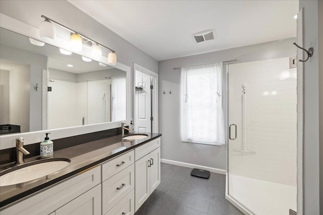 1269 Apple Creek Dr SE, Grand Rapids, MI 49546 - full bath featuring a stall shower, double vanity, baseboards, and tile patterned flooring