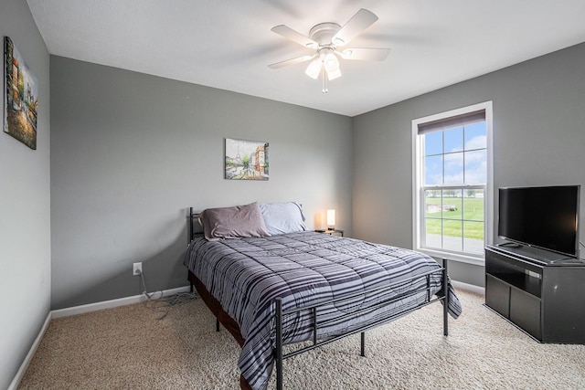 69218 Sundance Dr, Edwardsburg, MI 49112 - bedroom featuring carpet flooring, baseboards, and ceiling fan