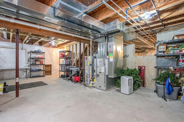 69218 Sundance Dr, Edwardsburg, MI 49112 - unfinished basement featuring water heater and heating unit