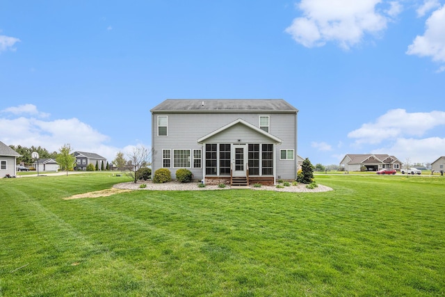 69218 Sundance Dr, Edwardsburg, MI 49112 - rear view of property featuring a sunroom and a lawn