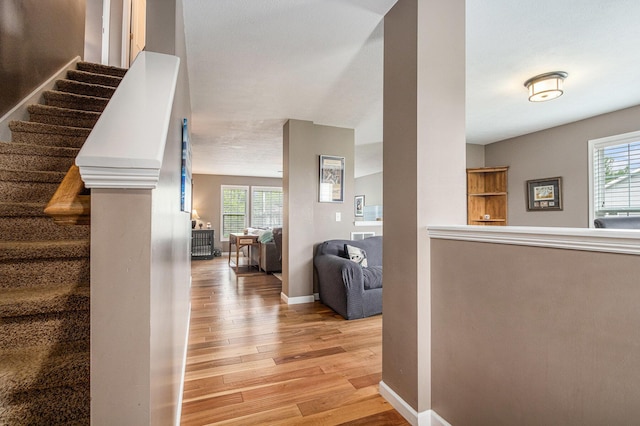 69218 Sundance Dr, Edwardsburg, MI 49112 - staircase featuring wood finished floors and baseboards