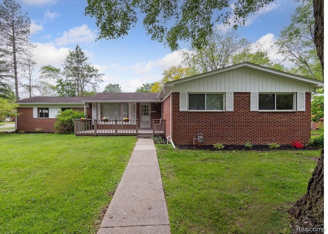 2960 Marshall St, Ann Arbor, MI 48108 - view of front of property with brick siding, a front lawn, and board and batten siding