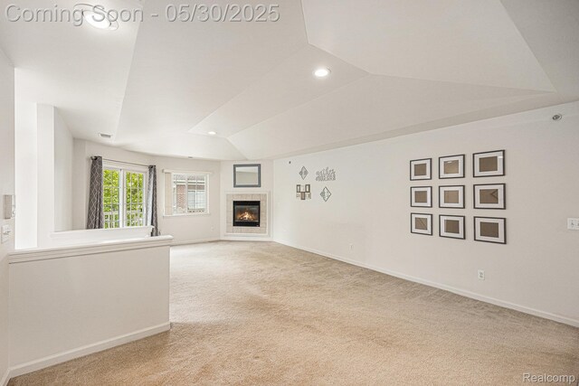 6769 Boulder Pointe Dr, Washington, MI 48094 - unfurnished living room with carpet flooring, vaulted ceiling, recessed lighting, a fireplace, and baseboards
