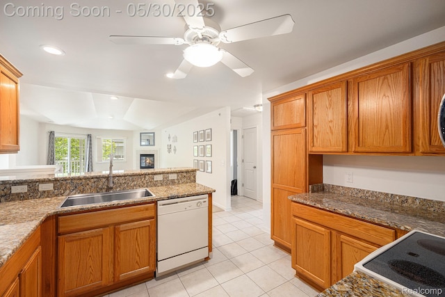 6769 Boulder Pointe Dr, Washington, MI 48094 - kitchen featuring white dishwasher, a sink, light tile patterned flooring, and brown cabinets