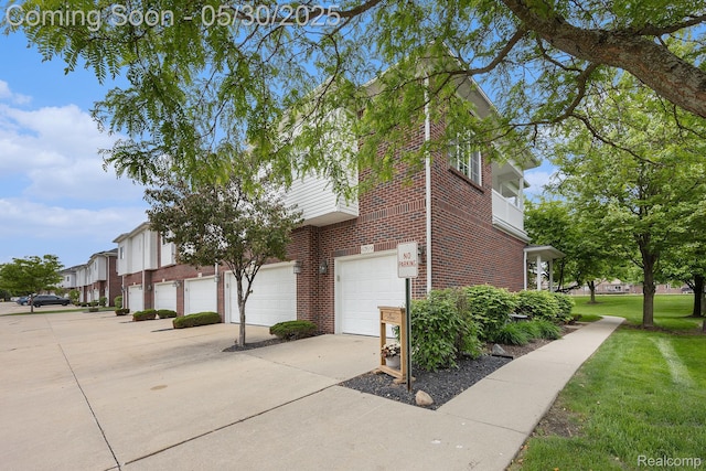 6769 Boulder Pointe Dr, Washington, MI 48094 - view of side of property featuring brick siding, a yard, an attached garage, and driveway