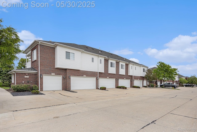 6769 Boulder Pointe Dr, Washington, MI 48094 - view of property featuring an attached garage and a residential view