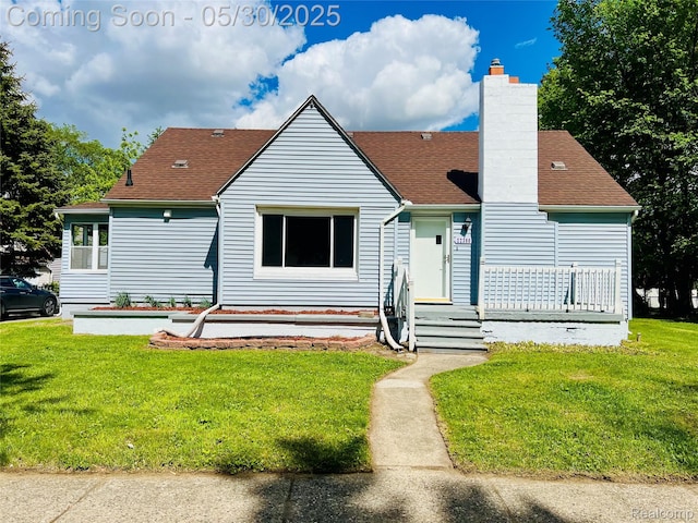 22380 Panama Ave, Sterling Heights, MI 48091 - view of front of house with a front lawn, a shingled roof, and a chimney