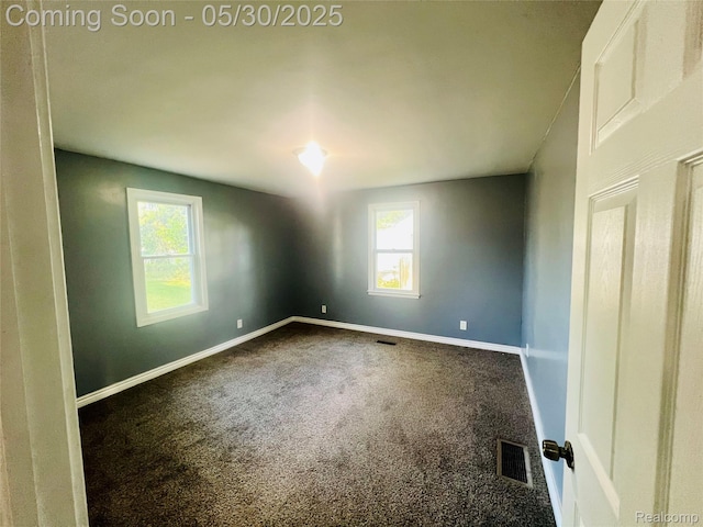 22380 Panama Ave, Sterling Heights, MI 48091 - unfurnished room featuring healthy amount of natural light, dark colored carpet, and baseboards