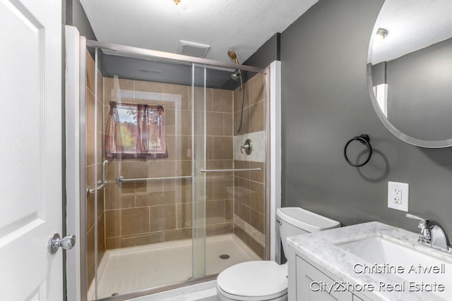 11943 Mulliken Rd, Mulliken, MI 48861 - bathroom with toilet, a shower stall, vanity, and a textured ceiling