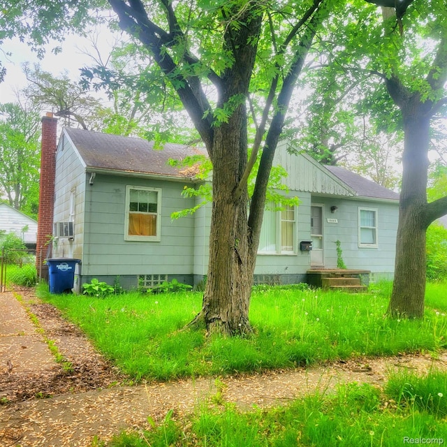 15440 Dacosta St, Detroit, MI 48223 - view of front of property featuring a chimney and cooling unit