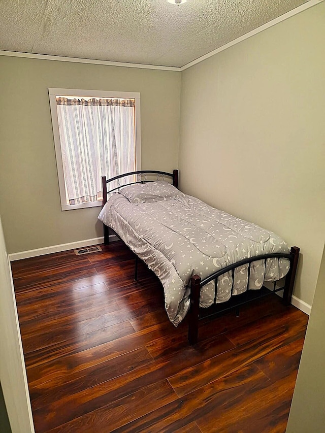 6334 N 168th Ave, Walkerville, MI 49459 - bedroom featuring hardwood / wood-style flooring, a textured ceiling, baseboards, and ornamental molding