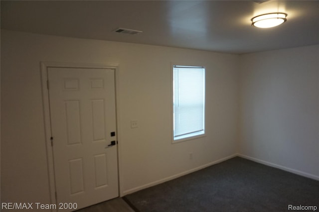 26017 Stanford St, Inkster, MI 48141 - empty room featuring baseboards and dark colored carpet