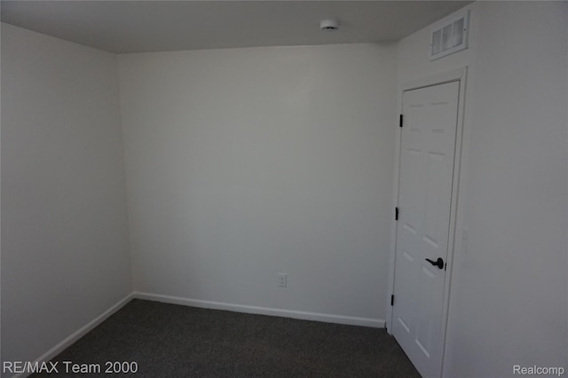 26017 Stanford St, Inkster, MI 48141 - unfurnished room with dark colored carpet, baseboards, and a smoke detector