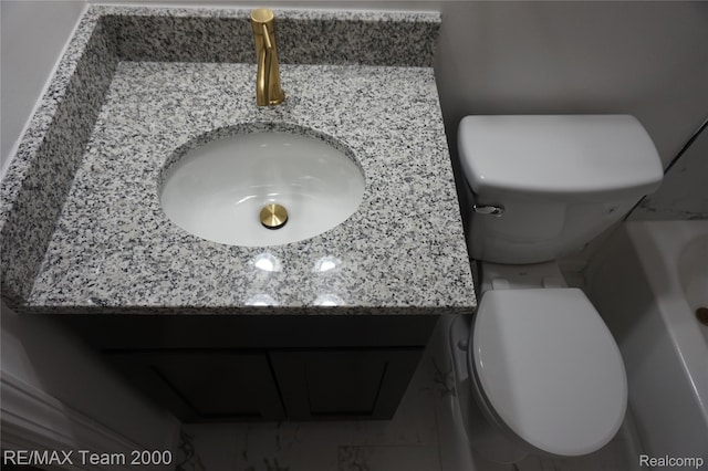 26017 Stanford St, Inkster, MI 48141 - bathroom featuring toilet, marble finish flooring, a bath, and vanity