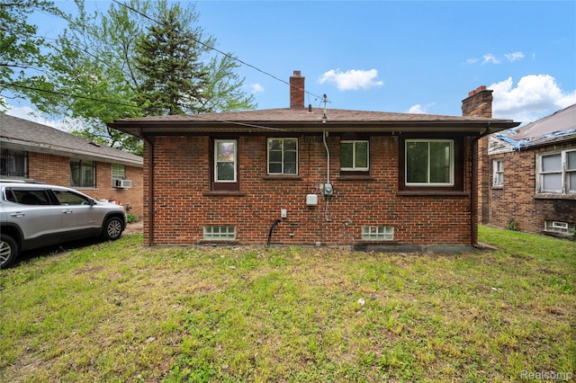 11780 Corbett St, Hamtramck, MI 48213 - back of property featuring a chimney, a yard, and brick siding