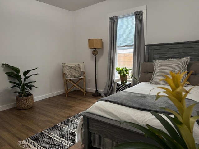 1581 W Lone Pine Dr, Baldwin, MI 49304 - bedroom featuring baseboards and wood finished floors