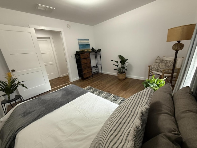 1581 W Lone Pine Dr, Baldwin, MI 49304 - bedroom with wood finished floors and baseboards