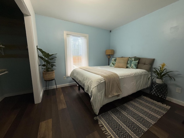 1581 W Lone Pine Dr, Baldwin, MI 49304 - bedroom featuring dark wood-style floors and baseboards