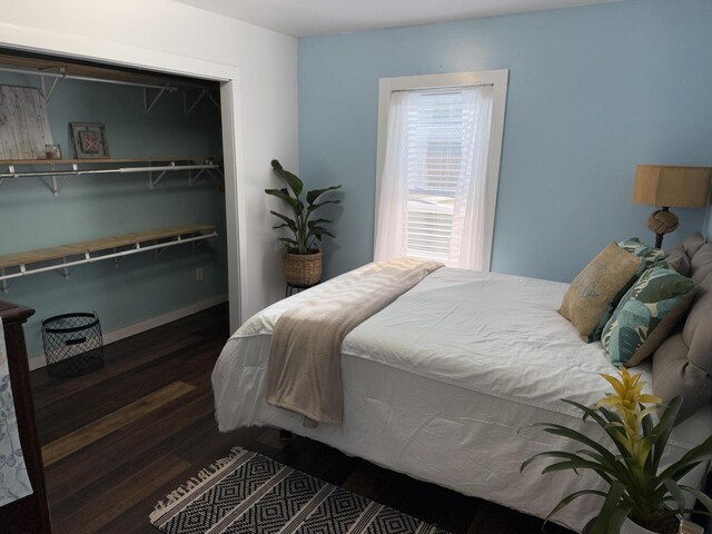 1581 W Lone Pine Dr, Baldwin, MI 49304 - bedroom featuring wood finished floors and baseboards
