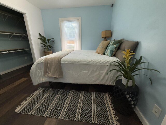 1581 W Lone Pine Dr, Baldwin, MI 49304 - bedroom featuring wood finished floors and baseboards
