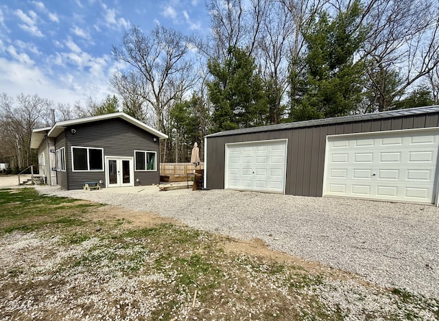 1581 W Lone Pine Dr, Baldwin, MI 49304 - garage featuring french doors and driveway