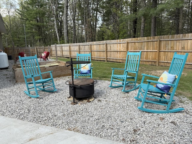 1581 W Lone Pine Dr, Baldwin, MI 49304 - fenced backyard featuring a fire pit