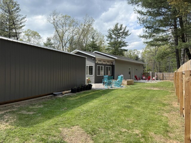 1581 W Lone Pine Dr, Baldwin, MI 49304 - back of house with a patio area