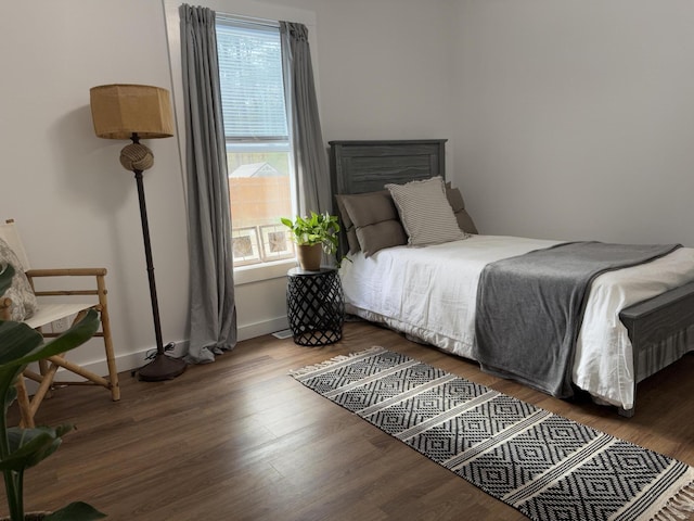 1581 W Lone Pine Dr, Baldwin, MI 49304 - bedroom with wood finished floors and baseboards