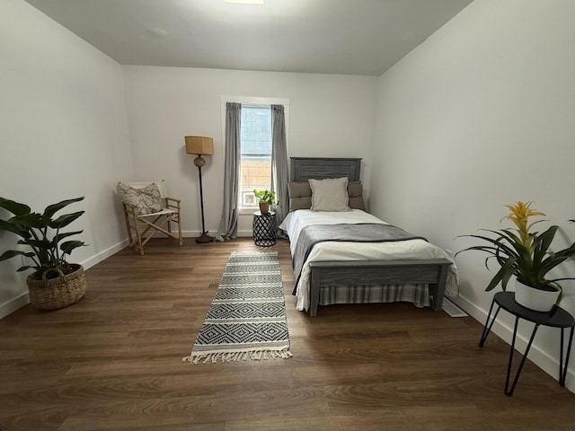 1581 W Lone Pine Dr, Baldwin, MI 49304 - bedroom with baseboards and wood finished floors