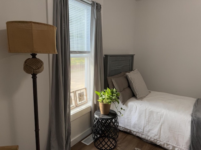 1581 W Lone Pine Dr, Baldwin, MI 49304 - bedroom featuring dark wood finished floors and baseboards
