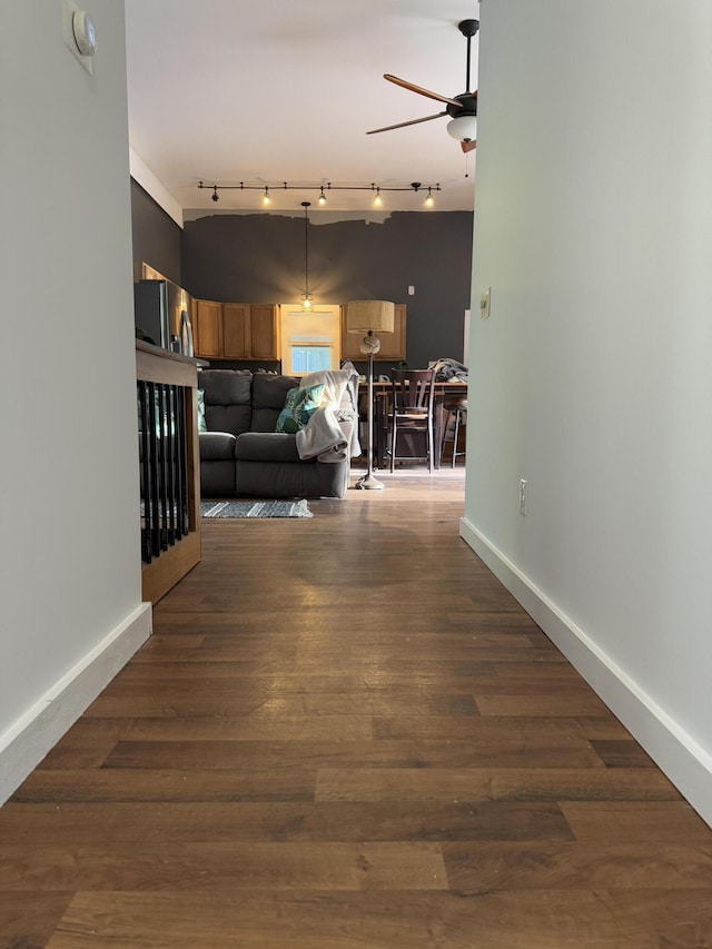 1581 W Lone Pine Dr, Baldwin, MI 49304 - living area with ceiling fan, baseboards, and dark wood-style flooring