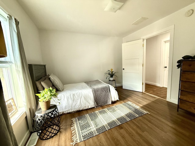1581 W Lone Pine Dr, Baldwin, MI 49304 - bedroom featuring wood finished floors and baseboards