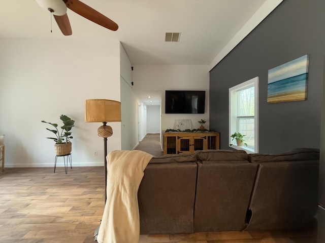1581 W Lone Pine Dr, Baldwin, MI 49304 - living room with light wood-type flooring, a ceiling fan, and baseboards