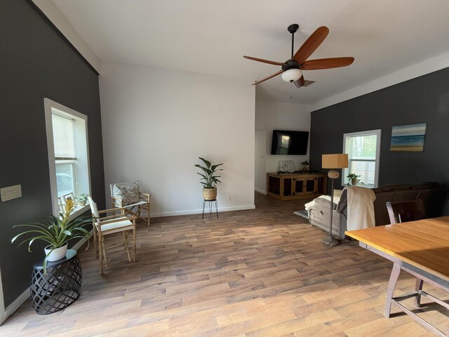 1581 W Lone Pine Dr, Baldwin, MI 49304 - dining space featuring ceiling fan, wood finished floors, and baseboards