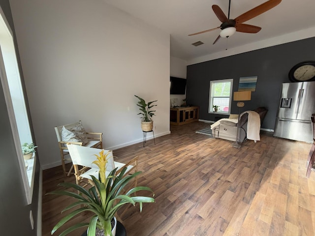 1581 W Lone Pine Dr, Baldwin, MI 49304 - living area with a ceiling fan, wood finished floors, and baseboards