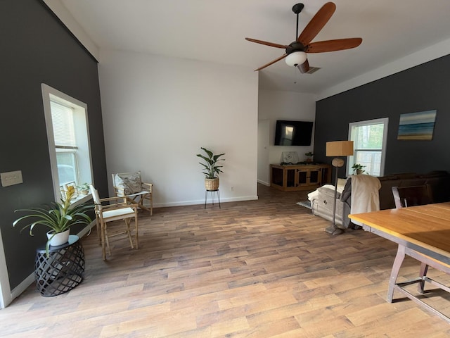 1581 W Lone Pine Dr, Baldwin, MI 49304 - dining area featuring ceiling fan, wood finished floors, and baseboards