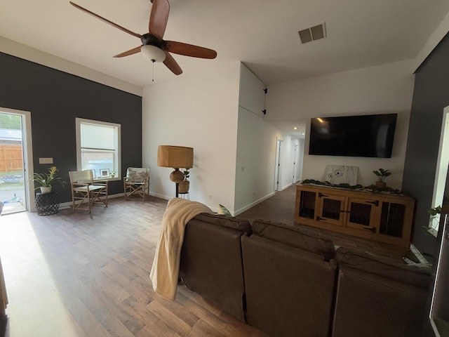 1581 W Lone Pine Dr, Baldwin, MI 49304 - living area with wood finished floors, a ceiling fan, and baseboards
