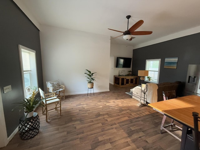 1581 W Lone Pine Dr, Baldwin, MI 49304 - dining space with a ceiling fan, wood finished floors, and baseboards