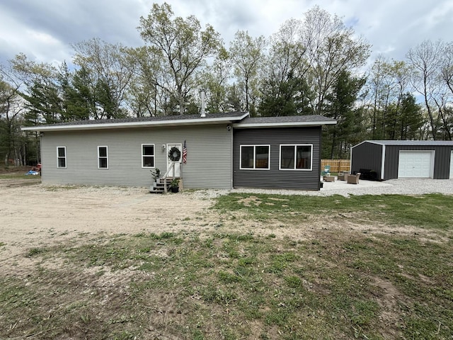 1581 W Lone Pine Dr, Baldwin, MI 49304 - back of house featuring entry steps and an outdoor structure