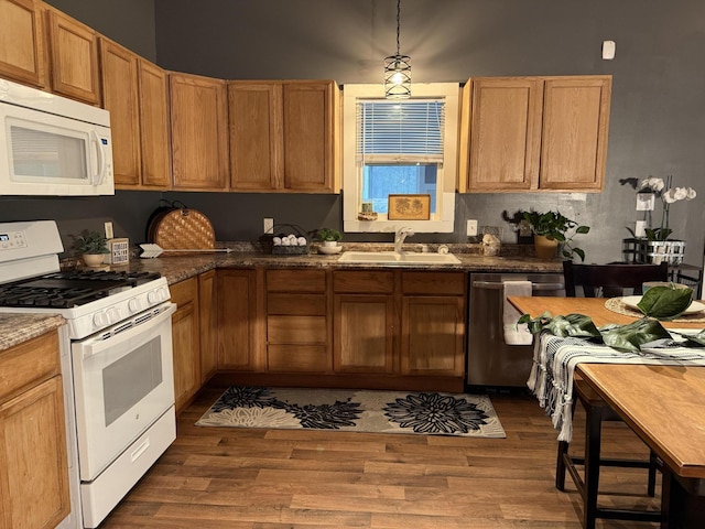 1581 W Lone Pine Dr, Baldwin, MI 49304 - kitchen featuring white appliances, a sink, dark wood-type flooring, and dark countertops